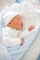 Wall Mural - Newborn baby laying in crib in prenatal hospital