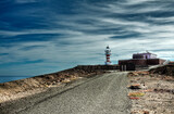 Fototapeta Kuchnia - road that takes us to the beautiful lighthouse of the town of Arinaga on the island of Gran Canaria Spain
