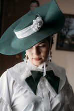 Portrait Of Beautiful Woman In Green Vintage Hat Veil 1800s Early 1900s Clothing.