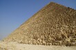 Pyramid of Cheops in the desert against the blue sky