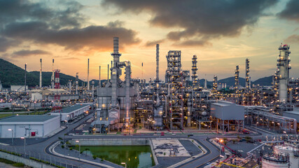Canvas Print - Oil and gas refinery plant form industry zone at night, Aerial view oil and gas Industrial petrochemical fuel power and energy.