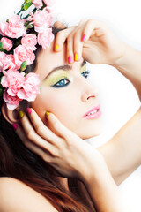 Beauty young real woman with pink flowers and make up closeup, spa salon, womans day concept