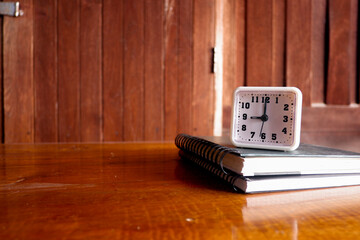 Fototapete - Cropped shot view of wood office desk table with the cup of coffee,office equipments, and other office supplies on the modern space, flat lay.