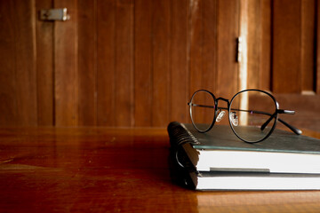 Fototapete - Cropped shot view of wood office desk table with the cup of coffee,office equipments, and other office supplies on the modern space, flat lay.
