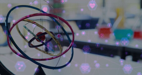Poster - Digital composite image of network of connection with interface icons against model of atom moving