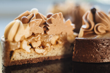 Shortbread tartlets with salted caramel and nuts. Sweet chocolate cakes. Modern mini desserts for candy bars, parties. Selective focus