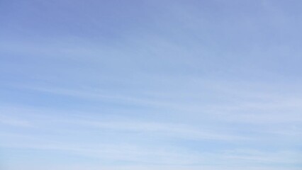 Wall Mural - 4k stock video timelapse of beautiful blue sky with soft white clouds isolated on sunny background. 