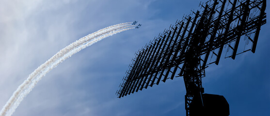 Air defense raiders of military mobile anti-aircraft complexes (radar is designed  and automatic tracking of targets and missiles) against the background of the flight of modern combat fighters,Russia