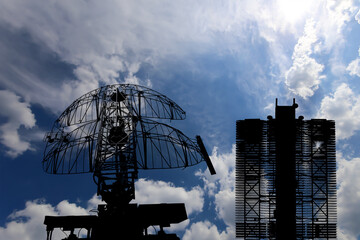 Wall Mural - Air defense radars of military mobile anti aircraft systems (radar is designed  and automatic tracking of targets and missiles) , modern army industry on background clouds and sky,Russia