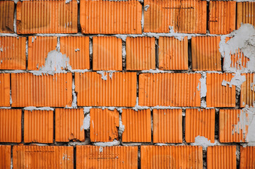 Wall Mural - Large old wall, background, texture of brown, red, orange dirty bricks in cement, cracked in stains. Photo of building materials.