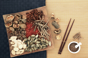 Poster - Traditional Chinese herbal plant medicine preparation with herbs and spice, chopsticks and mortar. Alternative natural holistic Asian healing remedy concept. On bamboo.