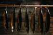 Smoked fish in smokehouse. Smoking Process Fish. Smoking fish hanging side by side in a smoker