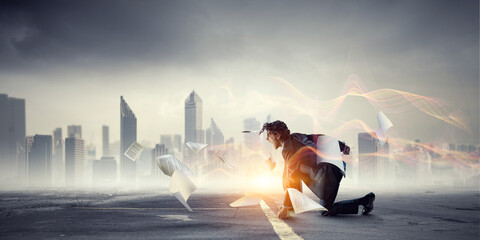 Wall Mural - Determined businessman leaving fire trails on asphalt