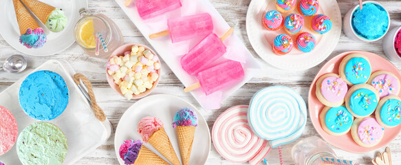 Poster - Pastel summer sweets table scene. Variety of ice cream, popsicles, cookies and treats. Top view over a rustic white wood banner background.