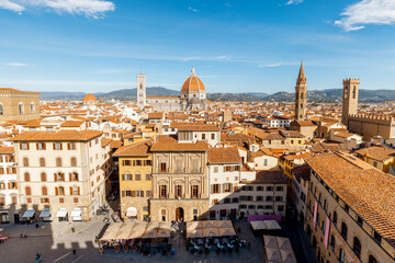 Wall Mural - Aerial view on the old town of Florence with famous Duomo cathedral on skyline on sunny day. Outstanding cityscape of tuscany. View from Vecchio palace