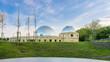 Silesian planetarium after renovation. The dome of the Silesian planetarium shining in the light of the setting sun. Aluminum panels on the roof .