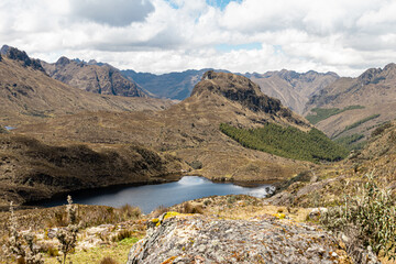 Wall Mural - Cajas National Park on sunny day. Patoquinoas Lagoon (Lake). South America, Ecuador, Azuay province close to Cuenca	