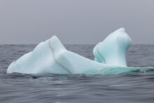 An Iceberg In The Ocean Of Newfoundland On A Rainy Day