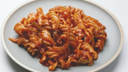 Wall Mural - Red sauce pasta slow-cooked in tomato sauce, prepared with flavourful spices