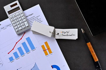 Poster - There is word card on the desk about Digital Transformation. It's placed with dummy documents.