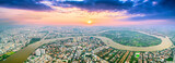 Fototapeta Na ścianę - Top view aerial of a Ho Chi Minh City, Vietnam with development buildings, transportation, energy power infrastructure. Saigon river and center city view from district 2