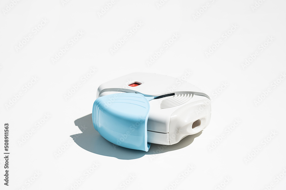 Asthma inhaler on white table. Aerosol for inhalation for treat lung ...