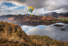 Beautiful Landscape Image Of Hot Air Balloon Flying Over Derwent Water In Lake District