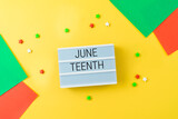 Fototapeta Kawa jest smaczna - African American holiday Juneteenth background with lightbox and colorful bright paper