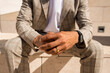Close-up of African American man hands. Male hands with ring and watch. Human body concept