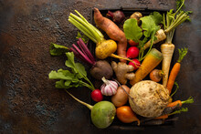 Fresh Root Vegetables In Wooden Box On Textured Background. Autumn Harvest. Concept Healthy Food.