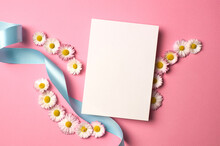 Greeting Or Invitation Card Mockup With Ribbon And White Daisy Flowers On Pink