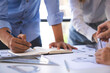 © crizzystudio - Engineer or architect meeting for project working with partner and engineering tools on model building and blueprint in working site, Construction, contract between two companies structure concept