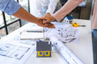 © crizzystudio - stack hands of business engineering and architect teamwork join together, construction engineer working  site, construction engineer conceptual,architect drawing on the architectural project