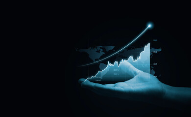 Hand holding virtual technical graph and chart for analysis stock market, technology investment and value investment concept.