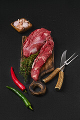 Wall Mural - Raw beef whole tenderloin for steak fillet mignon on black background