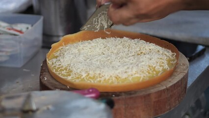 Wall Mural - Selective focus. Making a Malaysian Dessert, Apam Balik, Indonesian Dessert Terang Bulan, Martabak Manis. The process of making sweet martabak (terang bulan).