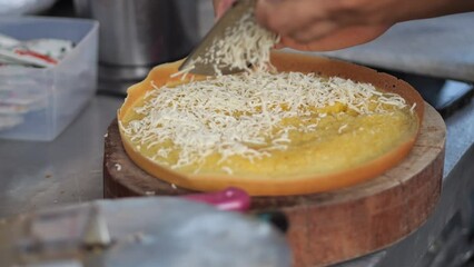 Wall Mural - Selective focus. Making a Malaysian Dessert, Apam Balik, Indonesian Dessert Terang Bulan, Martabak Manis. The process of making sweet martabak (terang bulan).