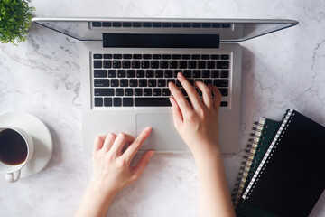 Fototapete - Cropped shot view of business woman’s hands typing the labtop with blank copy space screen for your information content or text message.