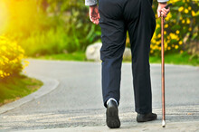 Disabled Person Walking On The Path
