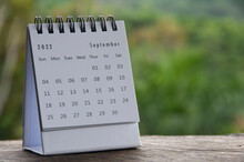 September Month Calendar With Blurred Nature Background. Copy Space And New Month Concept