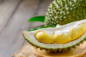 Wall Mural - Puangmanee durian on wood plate and wood background,