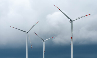 Wind farm in Poland. Windmills in arable fields. Renewable energy sources in Poland. Power plant wind turbines.