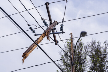 Unbelievable damage electricity supply lines after hurricane strength winds snap utility poles and overhead wires, causing widespread disruption.