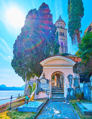 Canvas Print - The gate of Monumental Cemetery and bell tower of Santa Maria del Sasso Church, Morcote, Switzerland