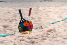 Beach Tennis Rackets And Balls On The Beach Sand