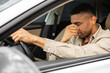 © Home-stock - Young man sitting inside his car and feeling stressed and upset