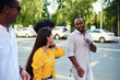 © etonastenka - Group of friends on walk outside together. Happy young men and women hiking in city together on a summer day