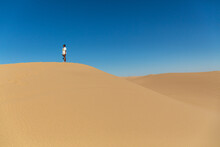 Black Woman On A Sand Dune