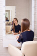 © Galina - Beautiful little girl with long healthy brunette hair in hairdressing salon