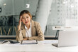 © PaeGAG - Very stressed business woman sitting in front of her computer, while holding a hand at her forehead.